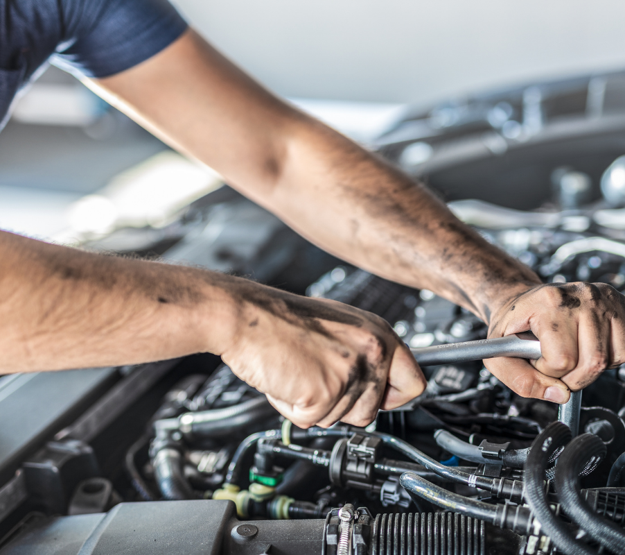 Mechanic performing engine repair at Airpark Auto Clinic in Arizona