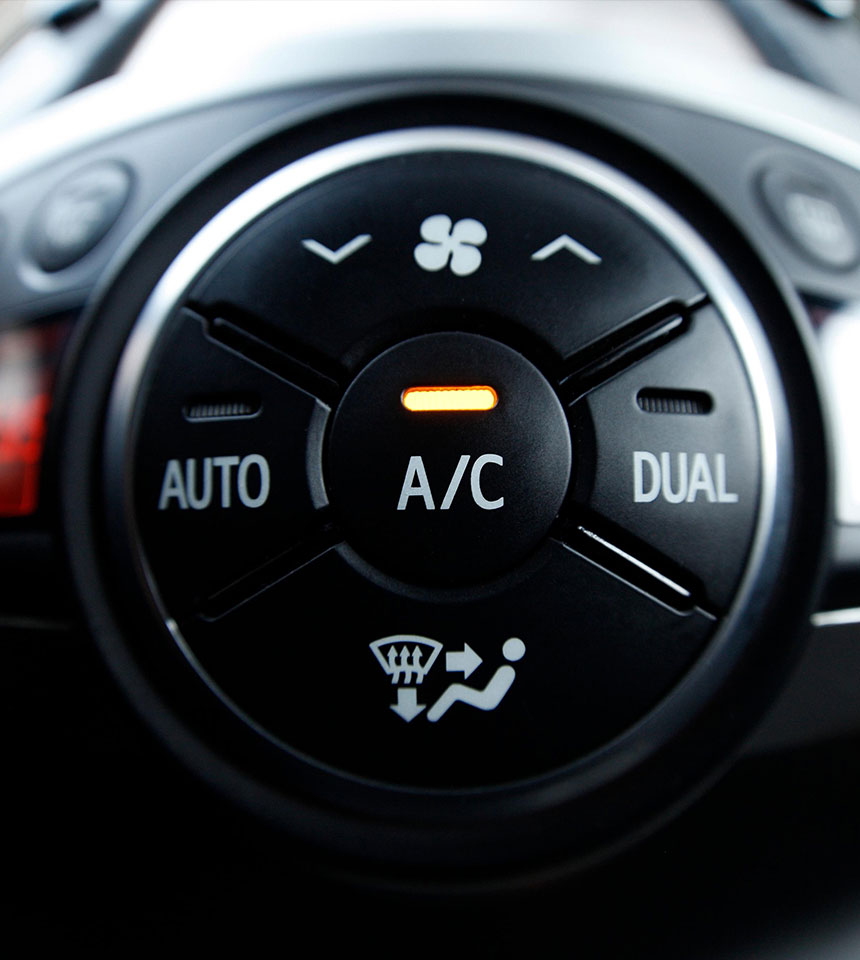 Vehicle A/C control panel representing auto air conditioning services at Airpark Auto Clinic.